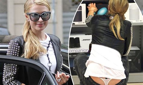 Paris Hilton Suffers Wardrobe Malfunction, Flashes Thong in。